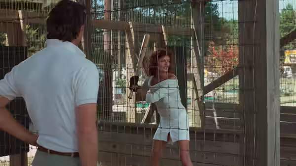 Annie Savoy (Susan Sarandon) swinging a bat inside a batting cage