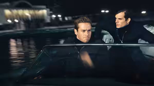 Napoleon Solo (Henry Cavill) and Illya Kuryakin (Armie Hammer) ride through the night in a car