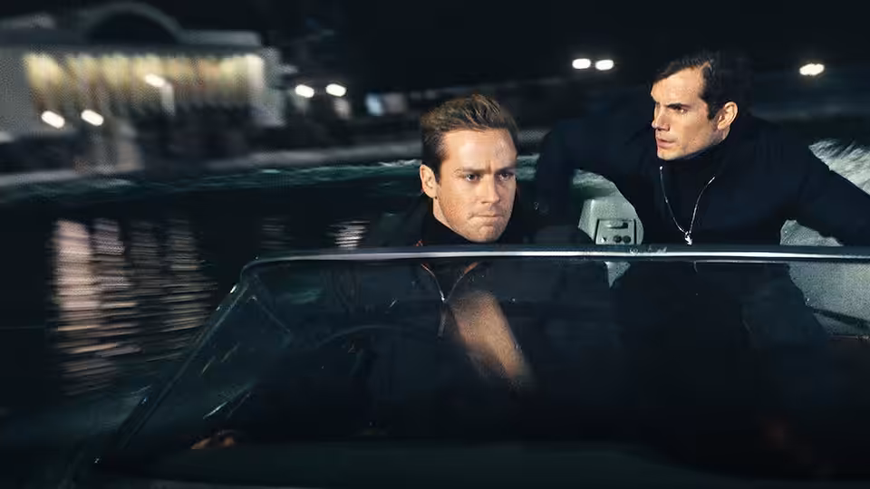 Napoleon Solo (Henry Cavill) and Illya Kuryakin (Armie Hammer) ride through the night in a car