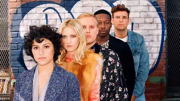 Dory Sief (Alia Shawkat) and friends pose in front of a graffiti-covered wall