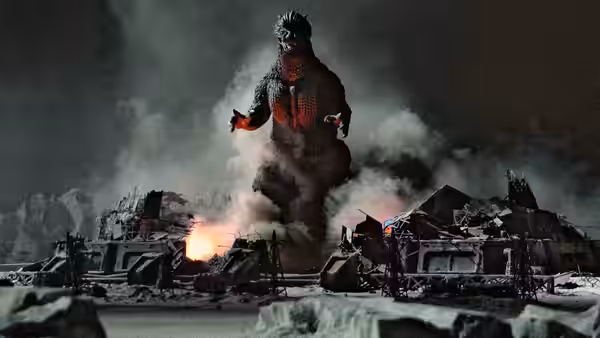 Godzilla with glowing red chest in a smoky destroyed landscape