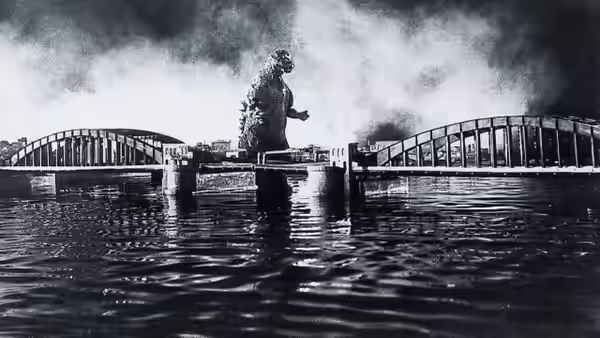 Godzilla standing on a pier between two bridges over water