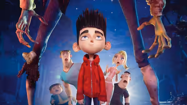 Norman Babcock (Kodi Smit-McPhee) looks up at giant zombie legs at night