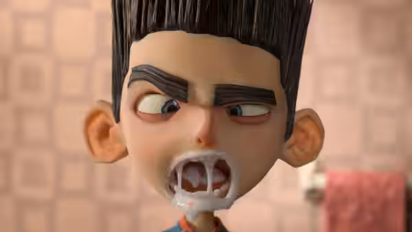 Norman Babcock (Kodi Smit-McPhee) bares sharp teeth with foam around his mouth
