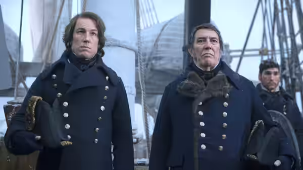 Captain Francis Crozier (Jared Harris) and Sir John Franklin stand on deck