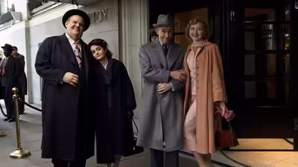 Oliver Hardy (John C. Reilly) poses with a dark-haired woman as Stan Laurel (Steve Coogan) stands with a blonde woman