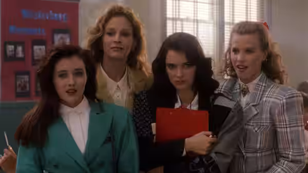 Veronica Sawyer and the Heathers in a school hallway