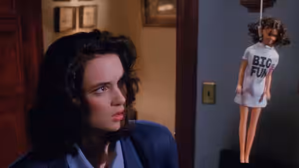 Veronica Sawyer (Winona Ryder) eyeing a hanging BIG FUN doll