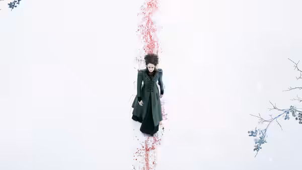 Vanessa Ives (Eva Green) lies in snow beside a long trail of blood