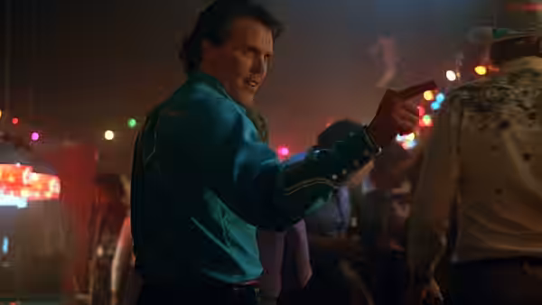 Ramrod (Wings Hauser) points a gun at someone in a crowded nightclub