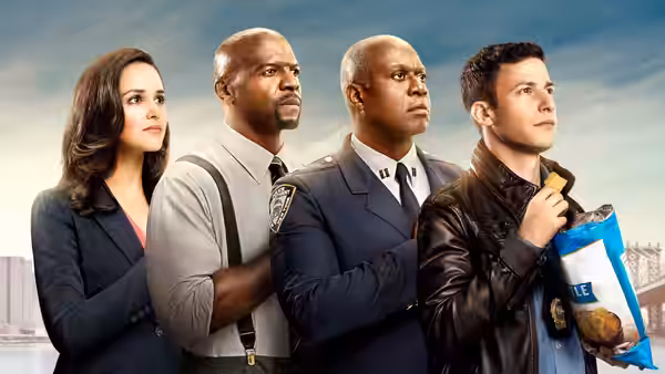 Four detectives stand side by side as one holds a bag of bagels