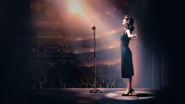 Midge Maisel (Rachel Brosnahan) performing on stage under a spotlight