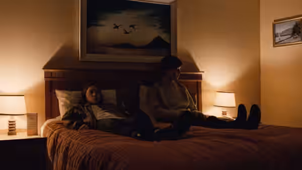 James (Alex Lawther) and Alyssa (Jessica Barden) lie side by side on a bed in a dimly lit room