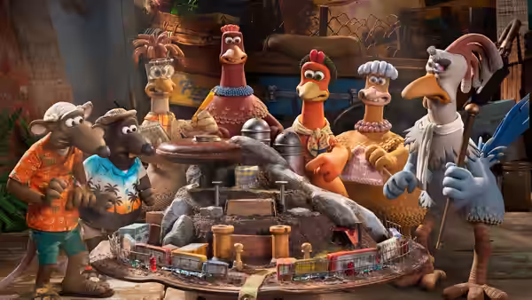 Animals gather around a miniature train layout in cluttered workshop