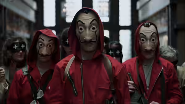 robbers wearing Dali masks and red jumpsuits inside a bank hall