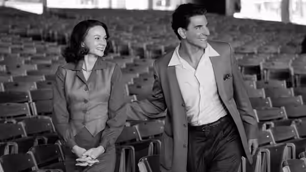 Felicia Montealegre (Carey Mulligan) and Leonard Bernstein (Bradley Cooper) in empty auditorium