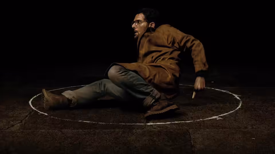 Ohm Bauman (Adam Scott) sitting inside a white circle on the floor