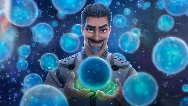 King Magnifico (Chris Pine) holds a glowing green orb surrounded by blue spheres