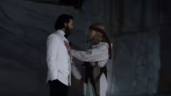 Joan (Anya Taylor-Joy) touches the chest of Mike Tyler (Chris Evans) in dim marble space