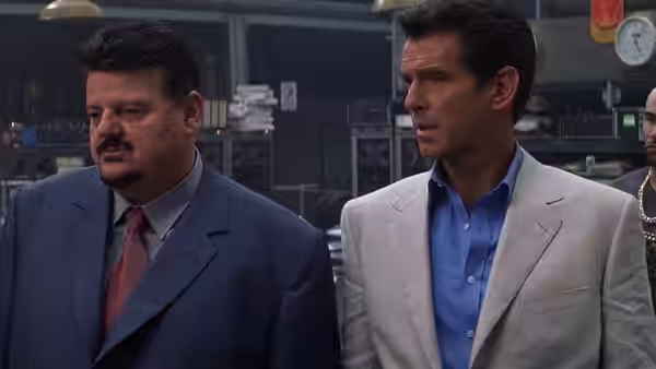 Pierce Brosnan as James Bond walks beside Robbie Coltrane as Valentin Zukovsky
