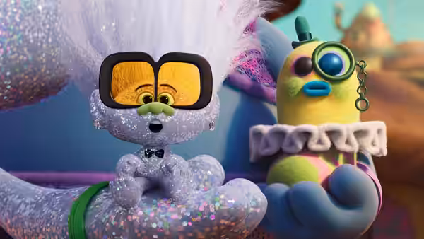 A glittery white creature in sunglasses holds a small yellow bird-like figure in one hand