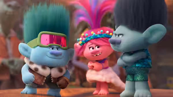 John Dory (Eric André) faces Poppy (Anna Kendrick) and Branch (Justin Timberlake) on a wooden stage