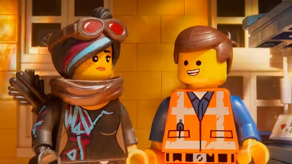 Wyldstyle (Elizabeth Banks) and Emmet (Chris Pratt) standing together outdoors