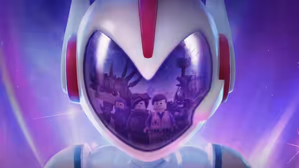 Minifigures reflected in the visor of a large white helmet