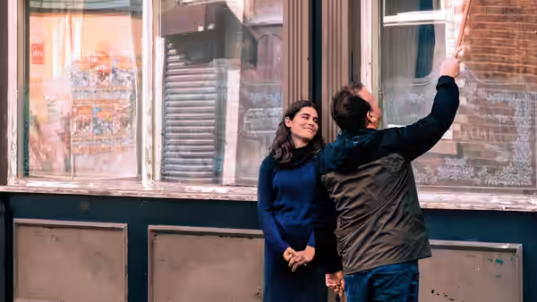 Yara (Ebla Mari) and TJ (Dave Turner) examine the pub windows