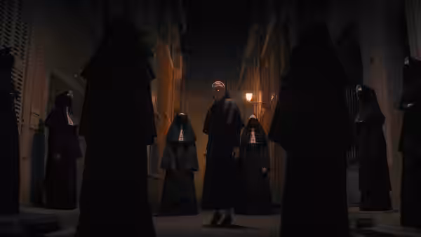 Group of nuns standing in a narrow street at night
