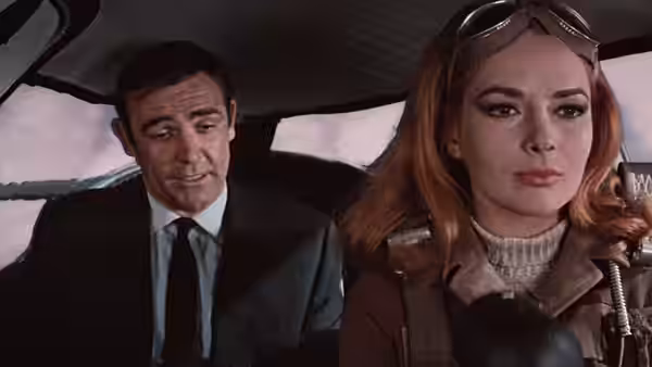 James Bond (Sean Connery) and Helga Brandt (Karin Dor) inside a vehicle cockpit