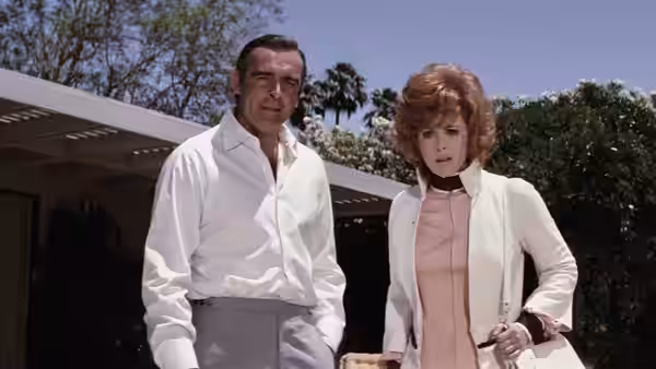 James Bond (Sean Connery) and Tiffany Case (Jill St. John) standing outdoors