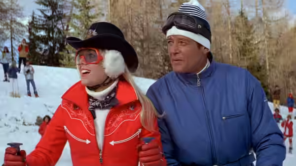 Bibi Dahl (Lynn-Holly Johnson) skiing with James Bond (Roger Moore) on snowy slopes