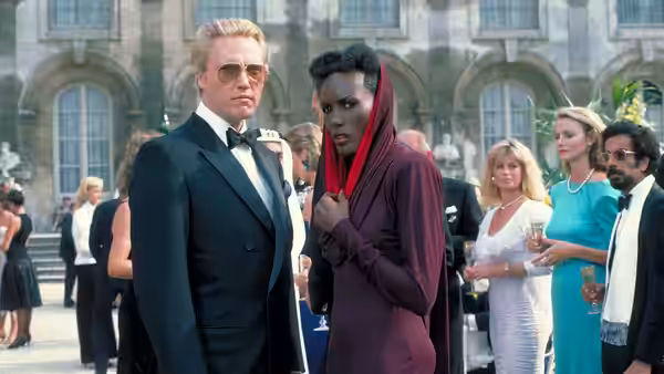 Max Zorin (Christopher Walken) and May Day (Grace Jones) at a formal event