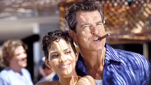 James Bond (Pierce Brosnan) smoking a cigar beside Jinx (Halle Berry)