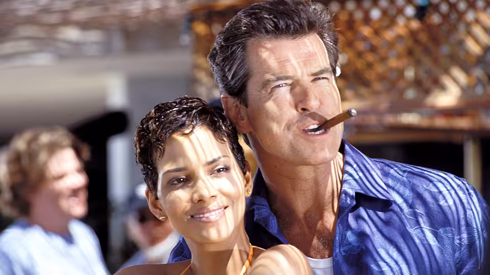James Bond (Pierce Brosnan) smoking a cigar beside Jinx (Halle Berry)