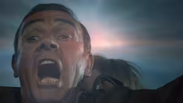 James Bond (Sean Connery) shouts with mouth open looking upwards