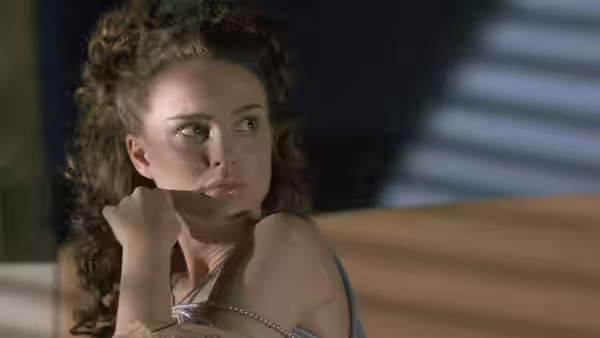 Padmé Amidala (Natalie Portman) gazing upward with her hand near her chin