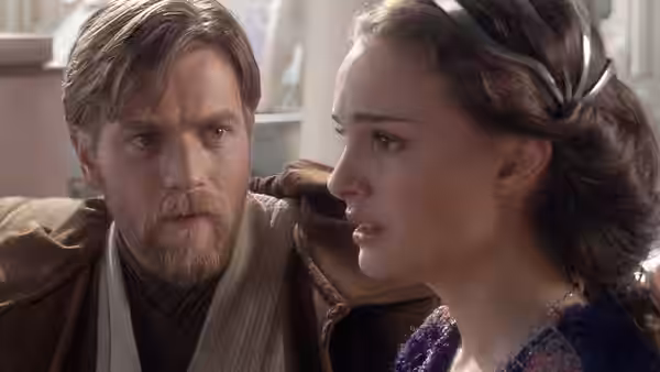 Obi-Wan Kenobi (Ewan McGregor) and Padmé Amidala (Natalie Portman) looking at each other