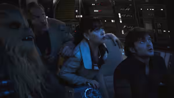 Qi'ra (Emilia Clarke) and Han Solo (Alden Ehrenreich) with Chewbacca in a cockpit