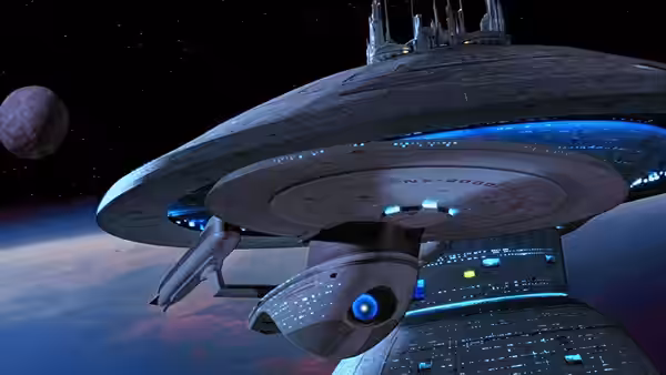 Large starship hovering in space above a planet and moon