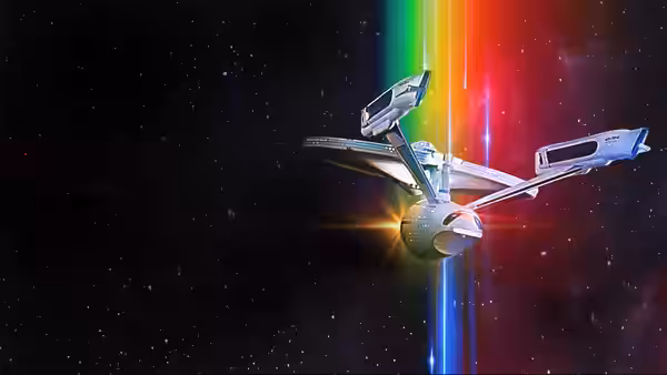The starship Enterprise passing through a rainbow beam in space