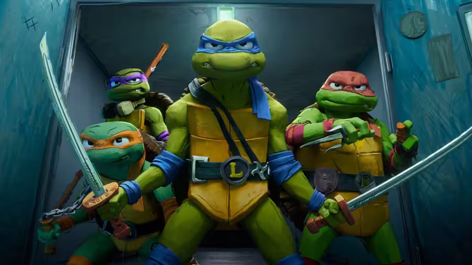 Four turtles in colorful masks stand ready with swords in a corridor