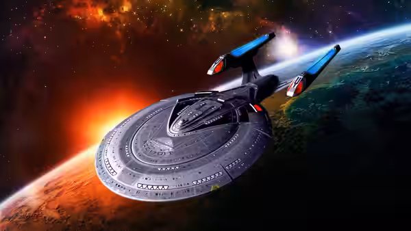USS Enterprise flies above a planet with orange atmospheric glow