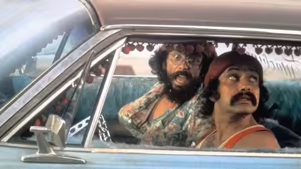 Pedro (Cheech Marin) and Man (Tommy Chong) look back from inside their decorated car