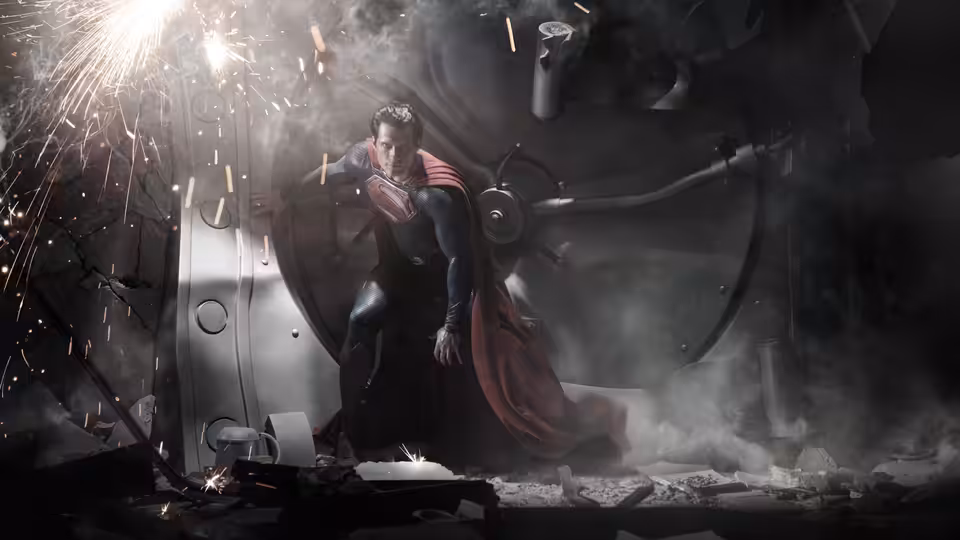 Superman (Henry Cavill) rises from wreckage amid sparks and smoke