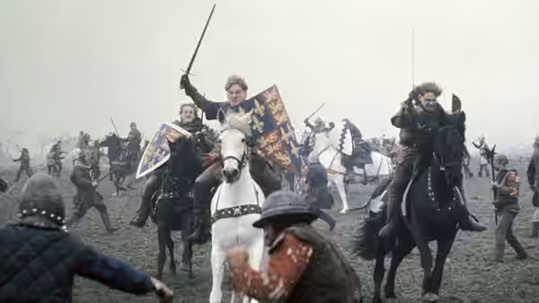 Henry V (Kenneth Branagh) charges on horseback among fighting soldiers