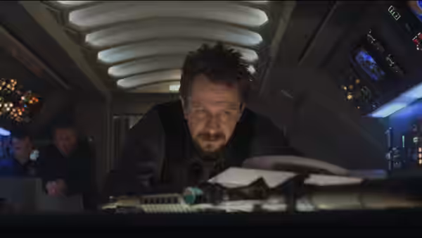 Ivan Korshunov (Gary Oldman) leans over the controls in the aircraft cockpit
