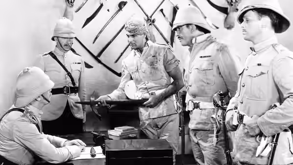 Uniformed officers study a map together at a table