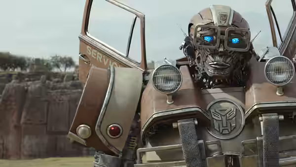 Robot with glowing blue eyes standing beside open service vehicle door outdoors